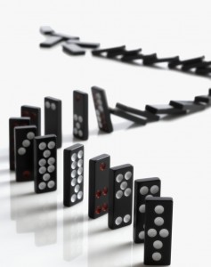 Falling Domino Pieces Arranged in a Line